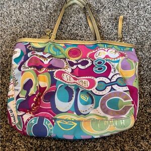 Bright colored Coach bag with pink inside